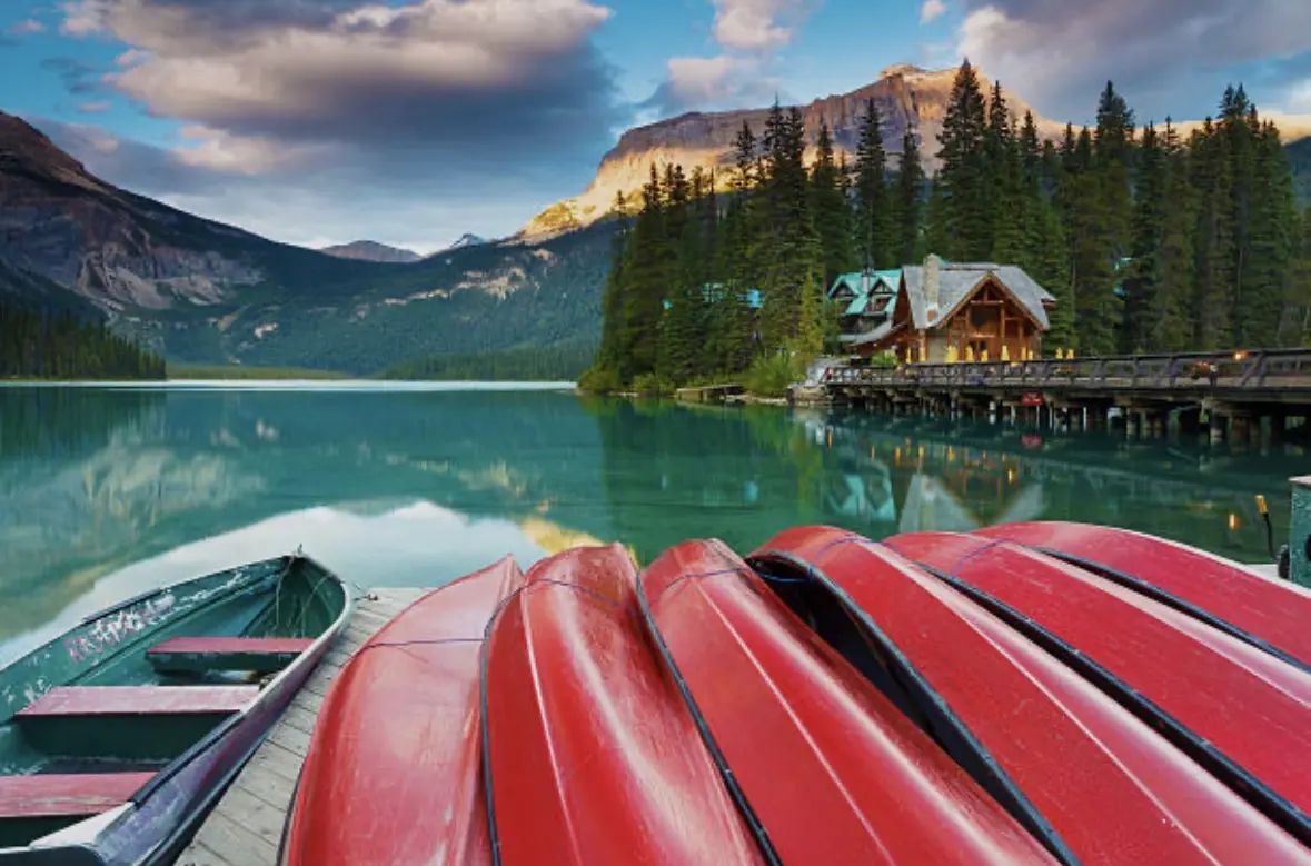 Emerald Lake reflecting forest and mountain peaks in Yoho National Park